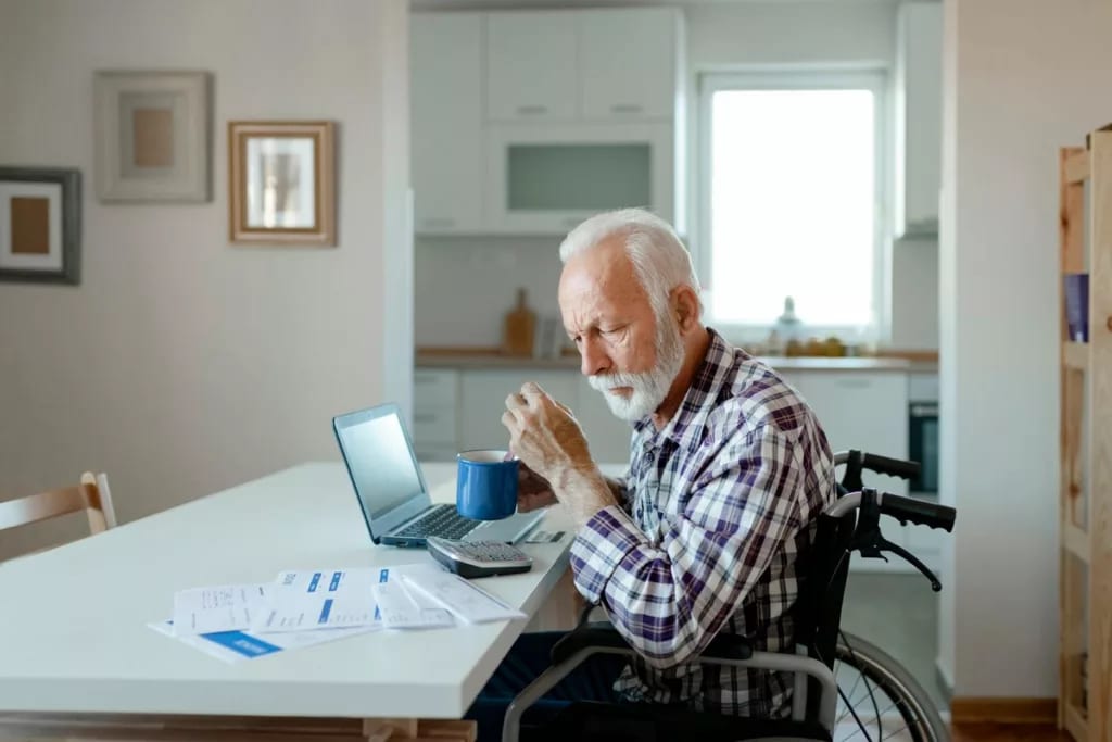 Older gentleman in wheelchair sits at kitchen.width PVLhTY.jpg
