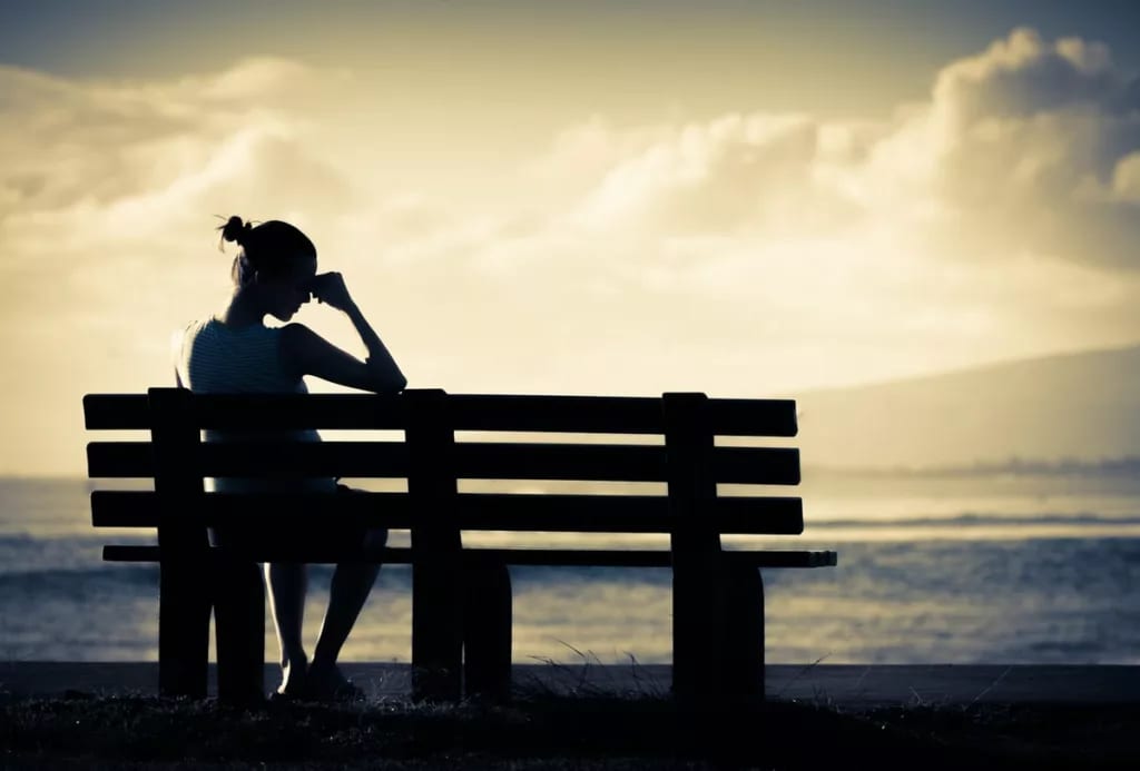 Silhouette upset woman on bench GmhxL.width .jpg