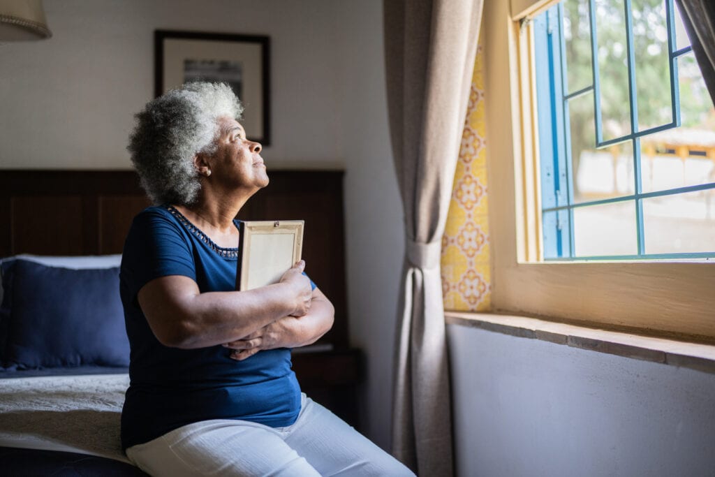 mourning loved one holding picture frame.jpg