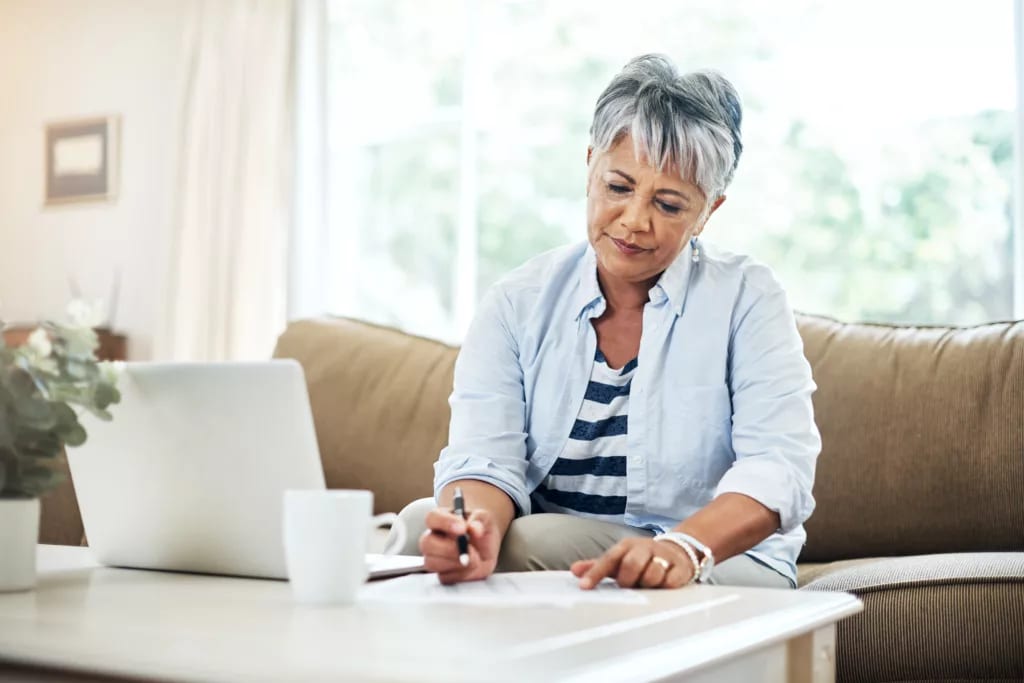 older woman laptop pen gettyimages .jpg