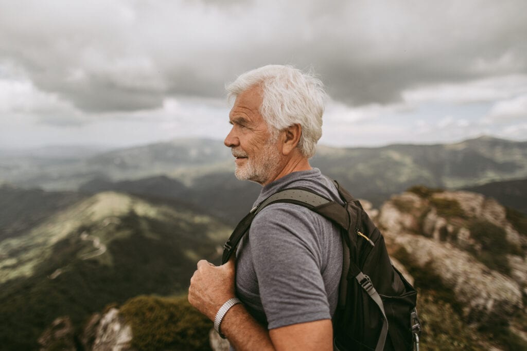 senior man outdoors backpack gettyimages .jpg