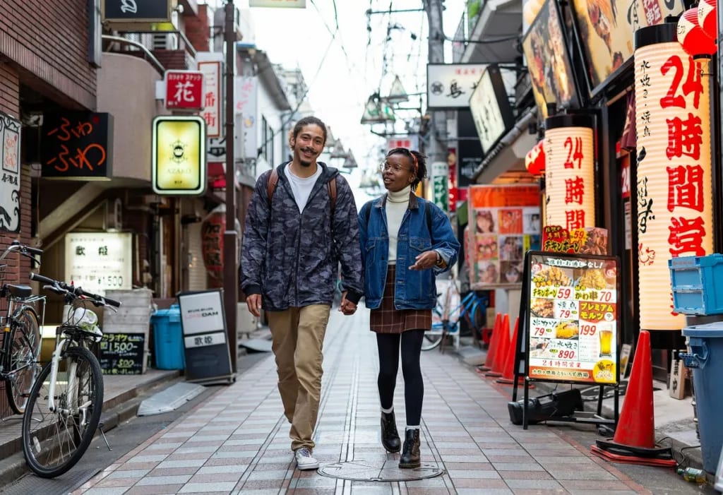 two people walking on street in tokyo uPbWw.width .jpg
