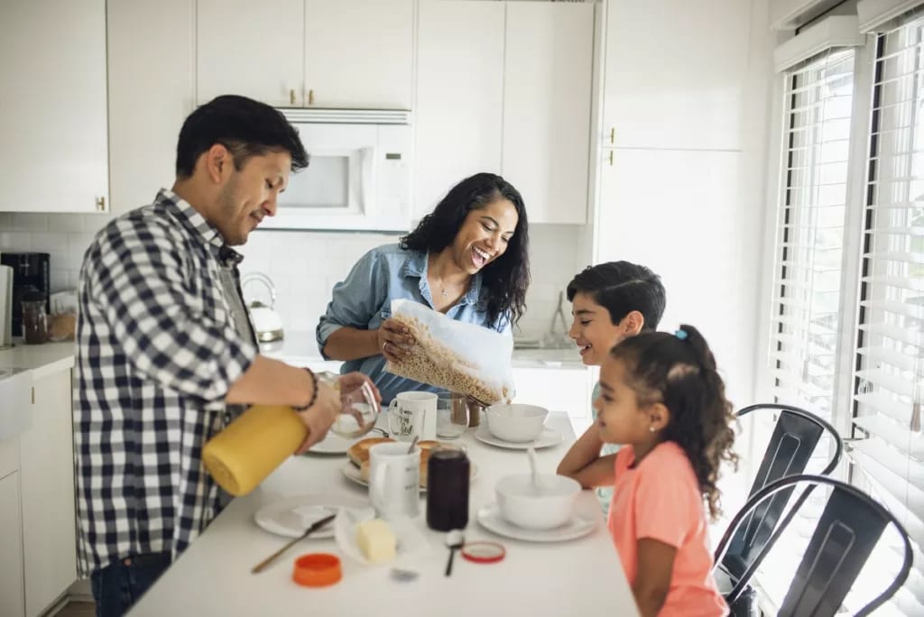 young family eating breakfast.width .jpg