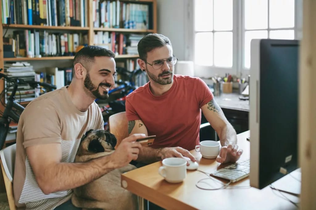 Two men shopping online credit card INXVtBn.width .jpg