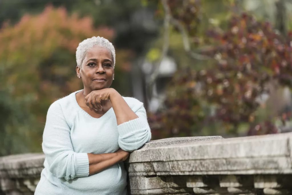 getty thoughtful older person outside at the park.jpg