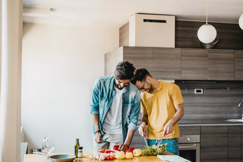 happy couple cooking together.width .jpg