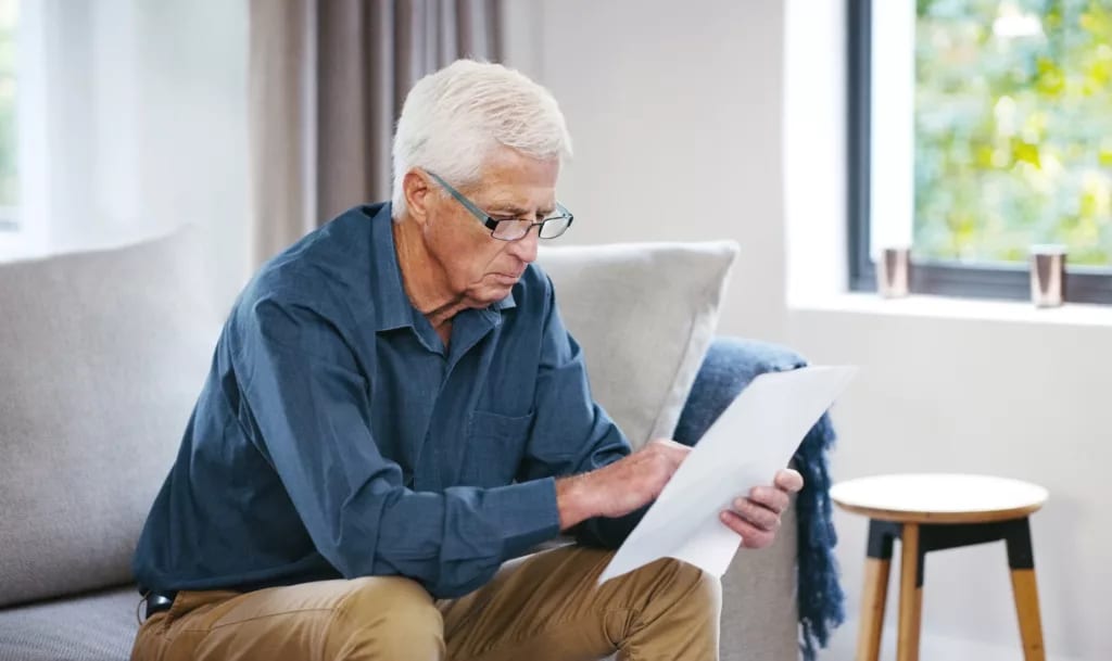 older man couch document gettyimages .jpg