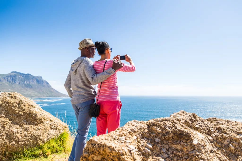 senior couple taking photo of the ocean.jpg