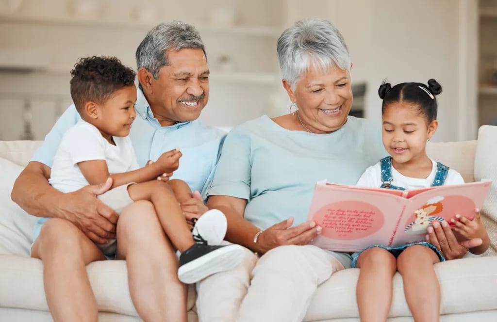 smiling couple reading books to children.jpg