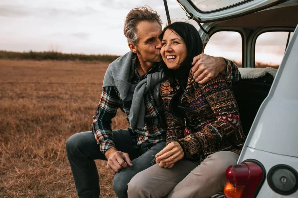 Middle age couple smiling in car CgSLrS.width .jpg