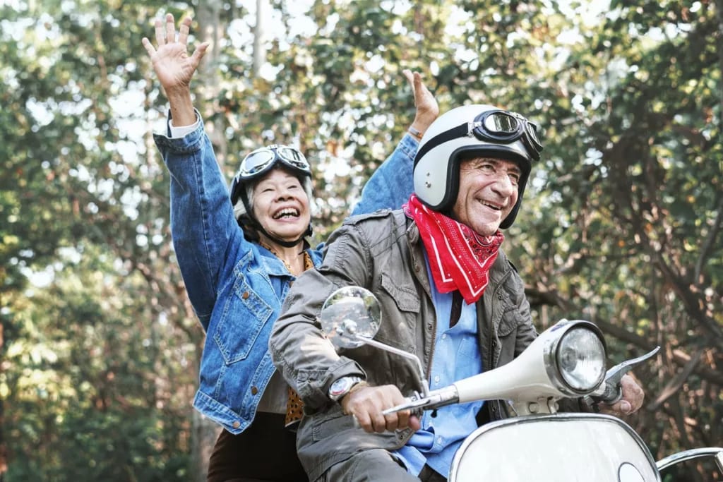 Retirees on a moped TMpuav.width .jpg