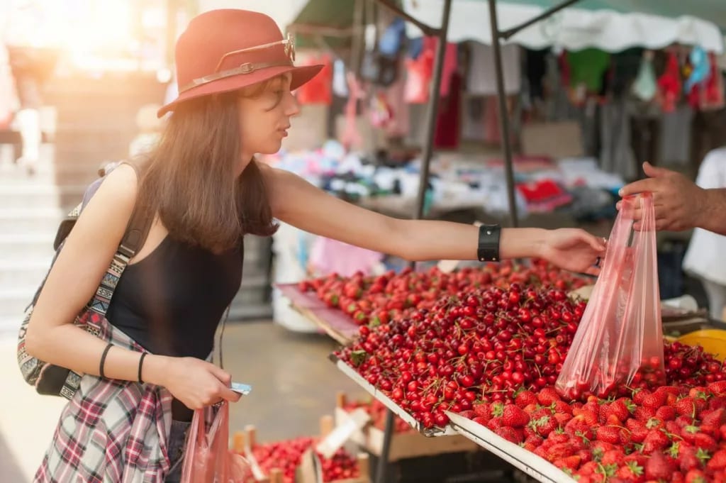 Young woman shopping farmers market jAjLon.width .jpg