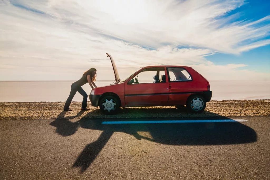 woman standing on the side of the road lookin.width iCnnai.jpg