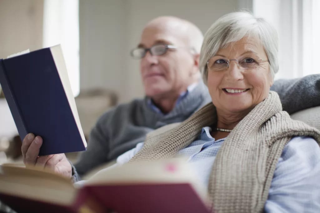 getty older couple reading books.jpg