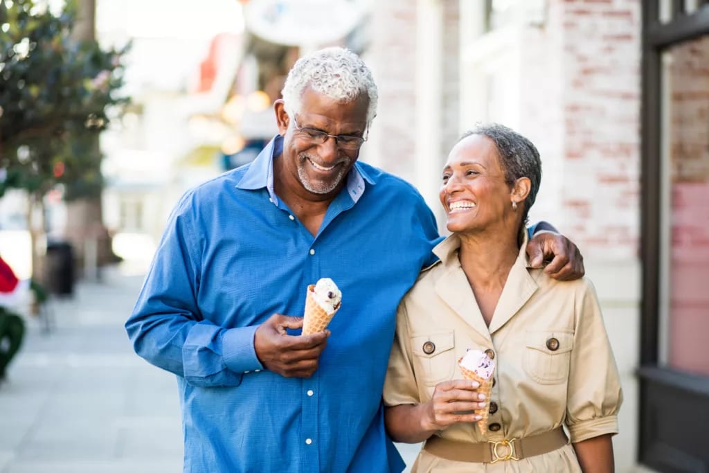 smiling couple eating ice cream cones.jpg
