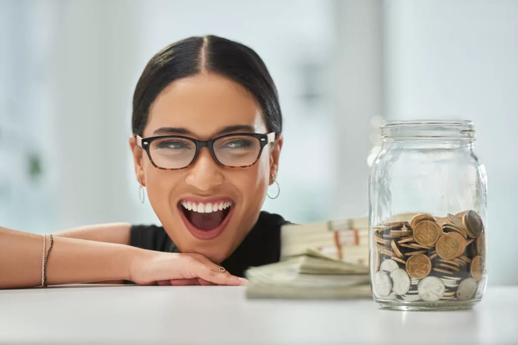 getty big smile jar of coins and cash millennial.jpg