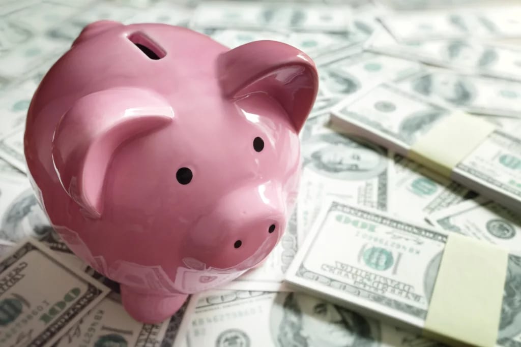 gettyimages piggy bank on a pile of money.jpg