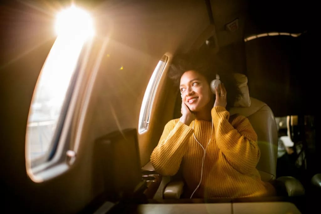 Airplane passenger listening to music olkY.width .jpg
