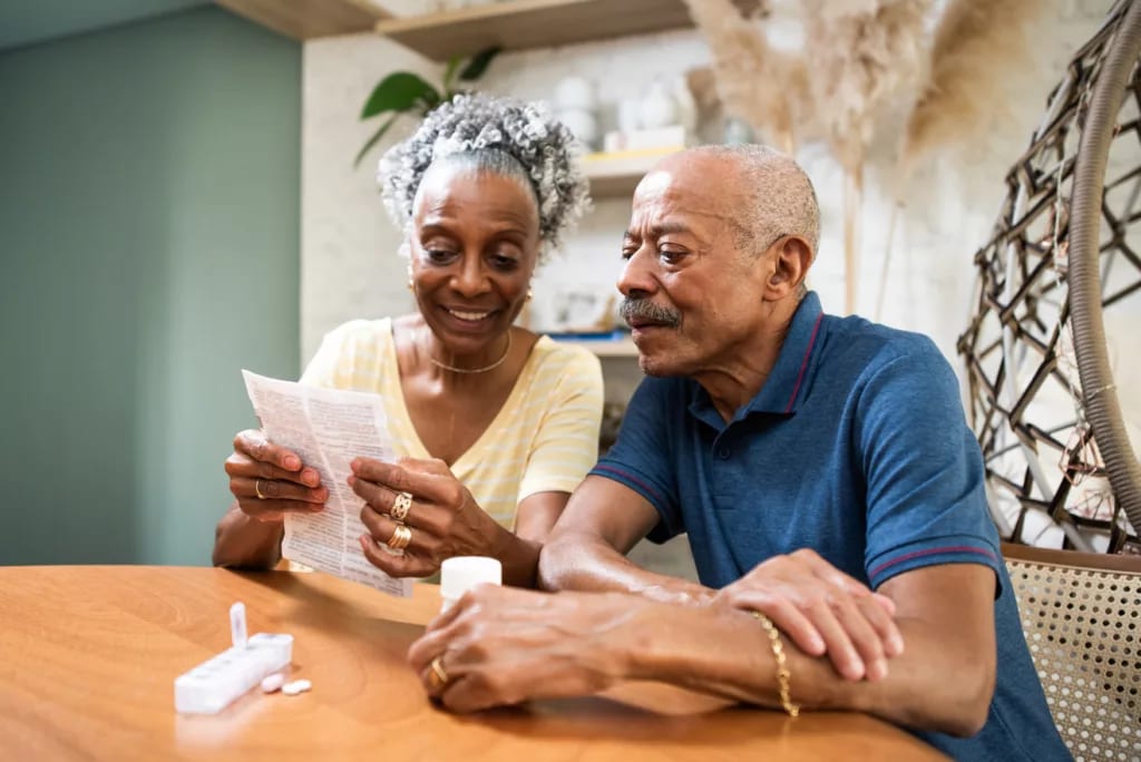 couple sitting at table looking at document.jpg