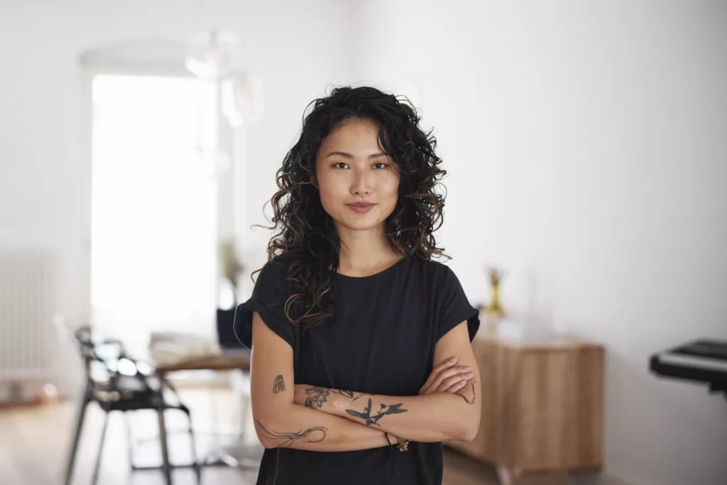 getty arms crossed strong serious expression thinking wondering.jpg