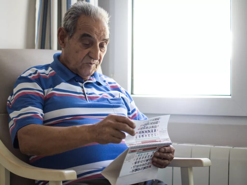 older person looking at a calendar.jpg