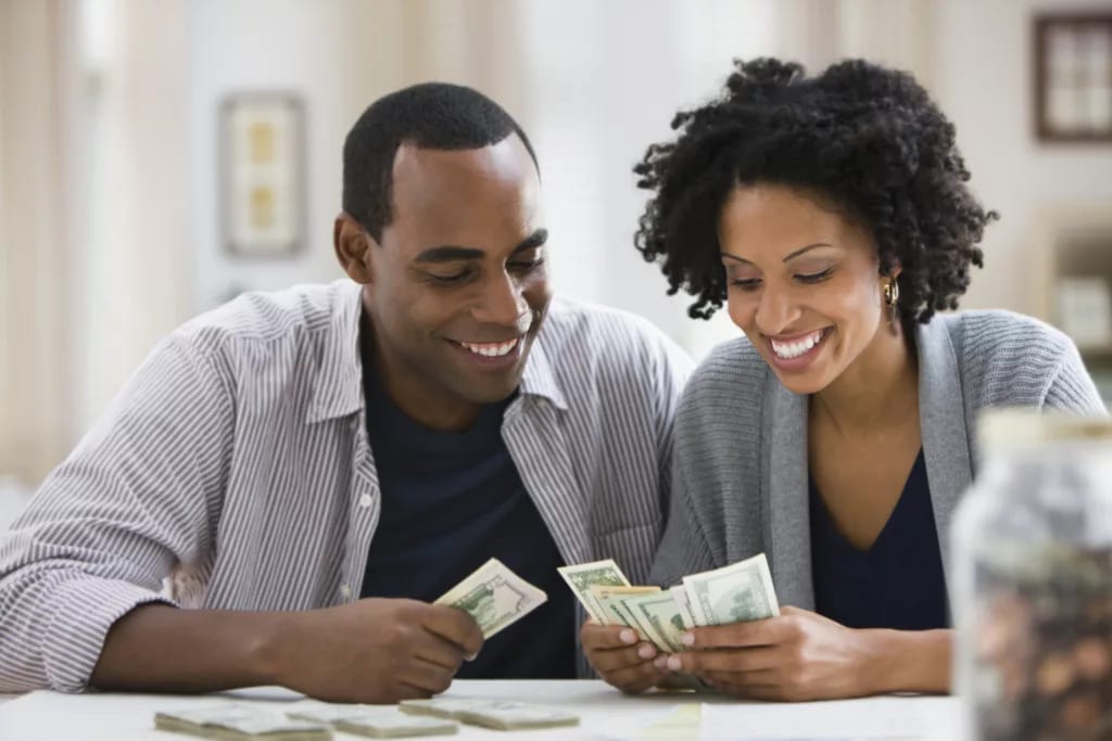 smiling couple counting money.jpg