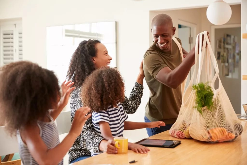 Father bringing home groceries to family GlSg.width .jpg