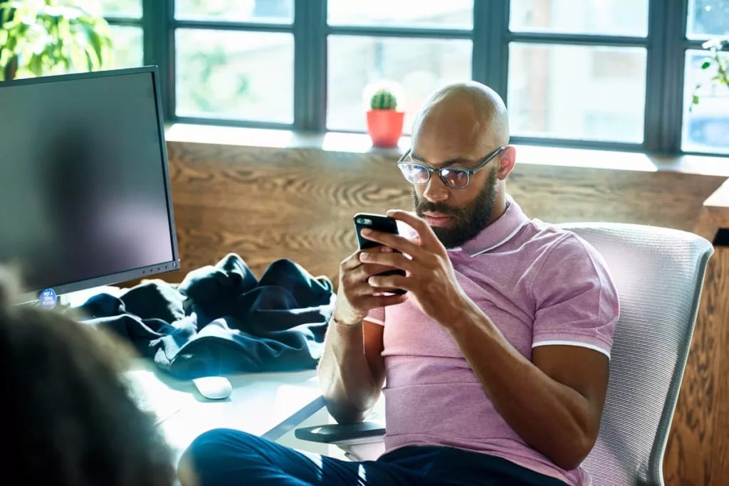 Man looking at phone contemplative QBnEzD.width .jpg
