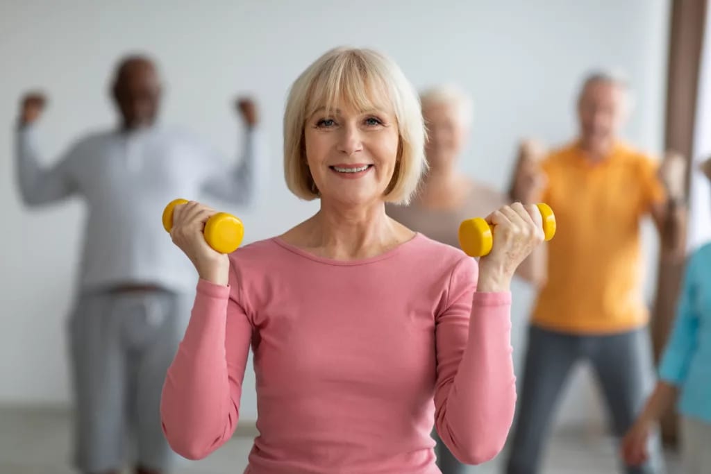 getty smiling with weights exercise fitness workout.jpg