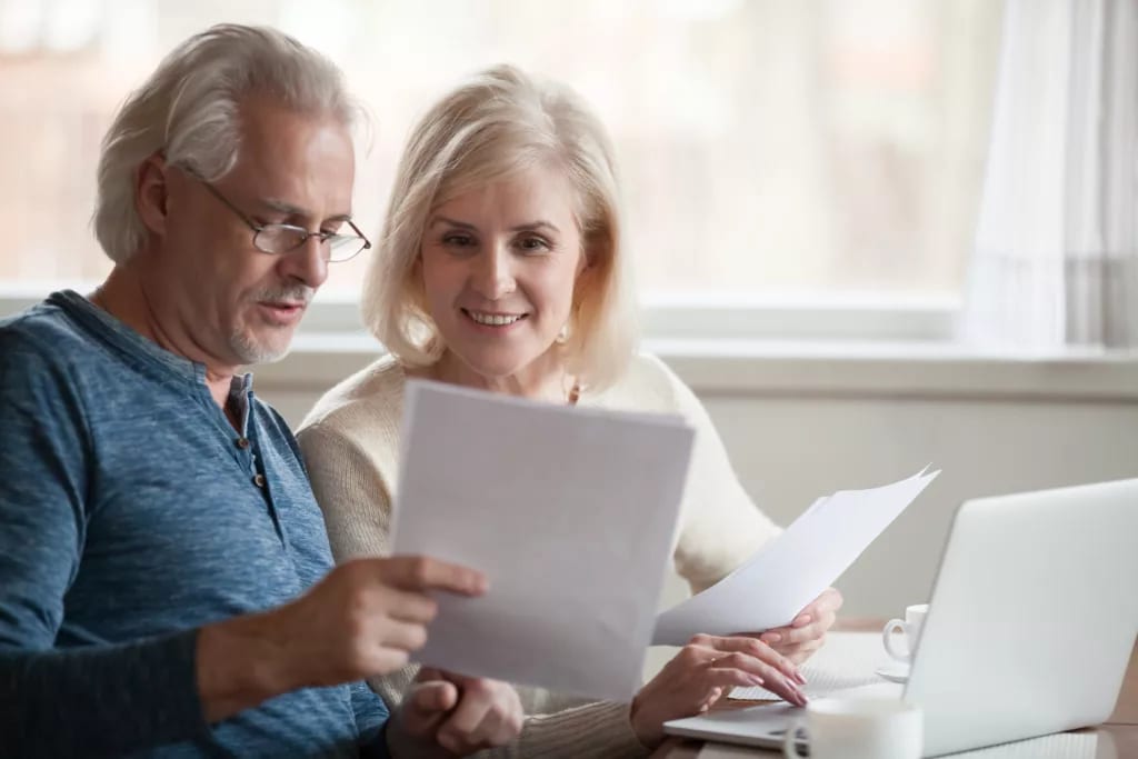 retired couple looks at papers.jpg