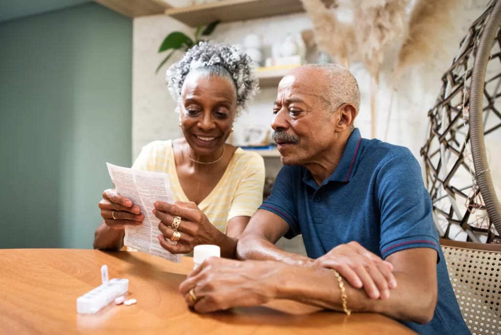 couple sitting at table looking at document.jpg