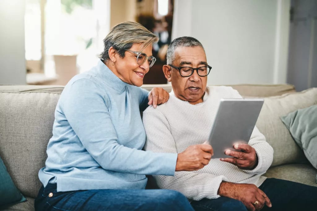 senior couple using a digital tablet at home.jpg