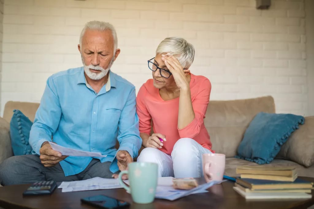 stressed couple looking at documents.jpg