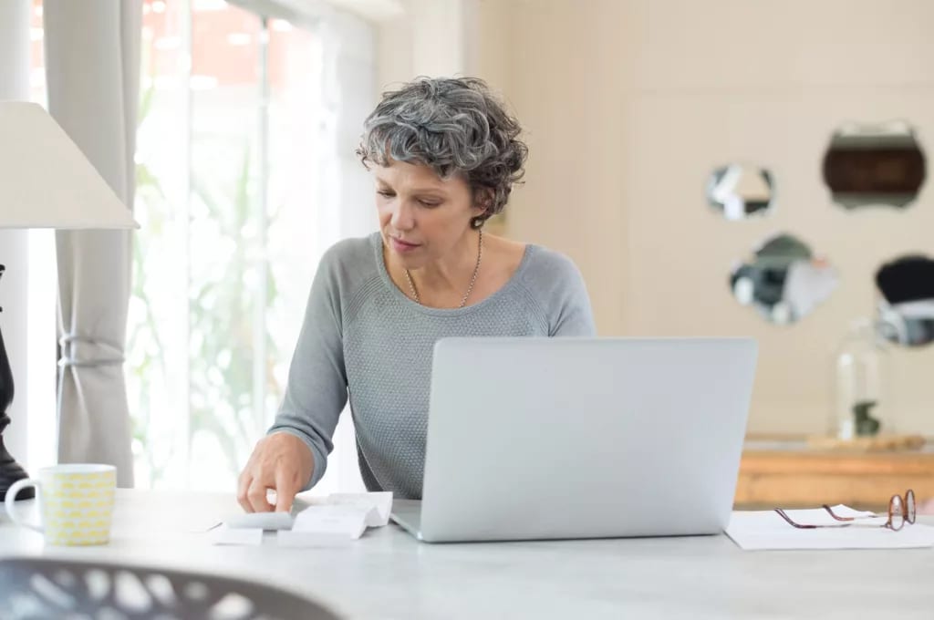 person sitting at table in front of computer.jpg