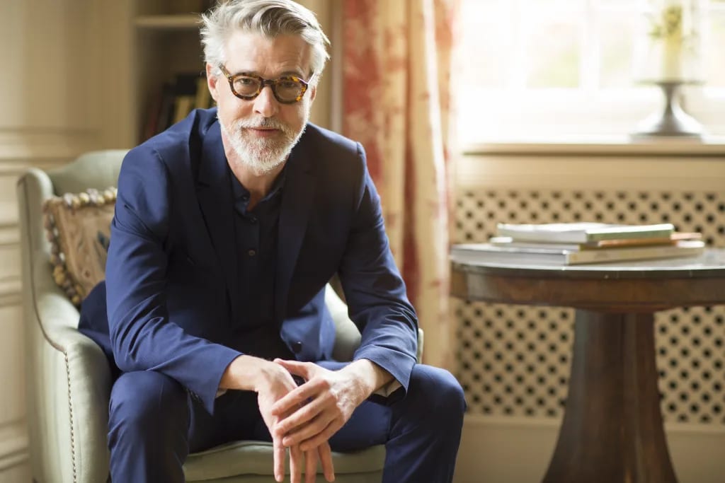 getty beard sitting serious expression blue shirt.jpg