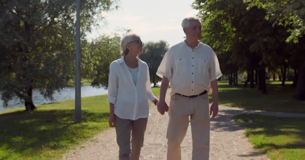 senior couple holding hands outside gettyimages .jpg