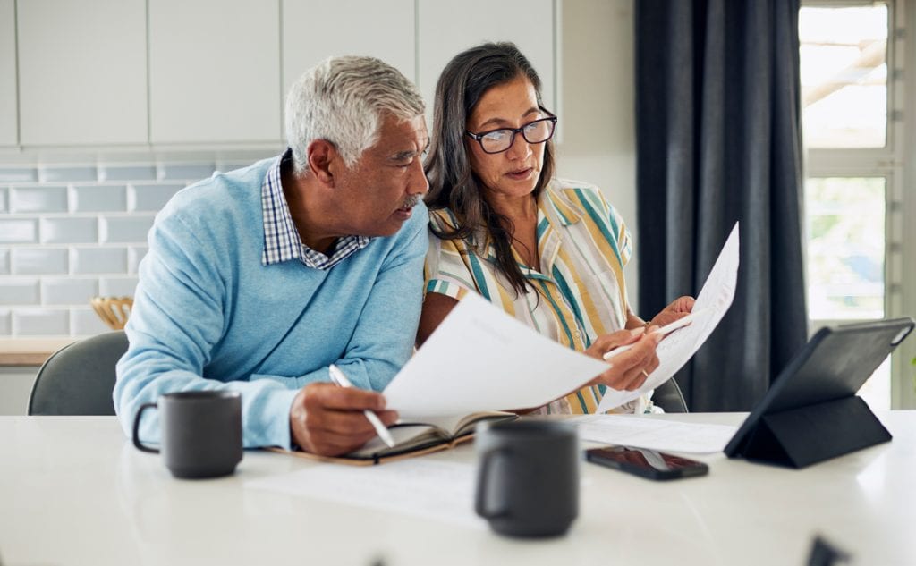 couple looking at documents together in kitchen.jpg