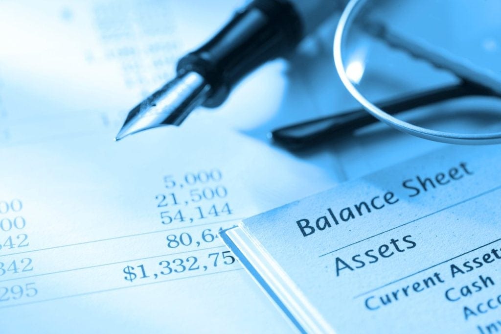 A balance sheet with a fountain pen.