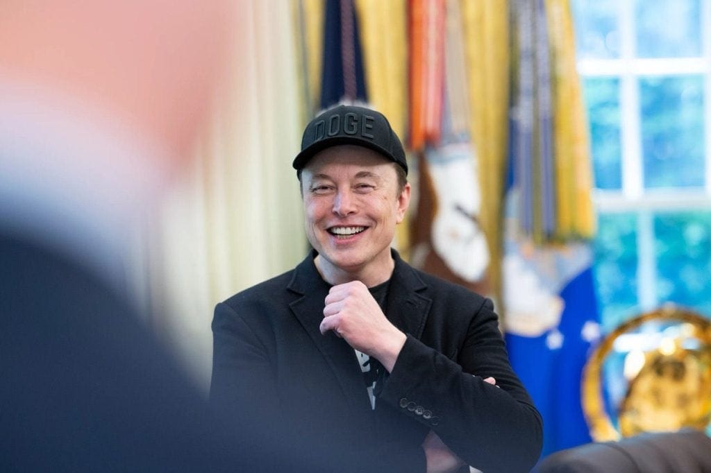 Elon Musk is standing in the Oval Office.