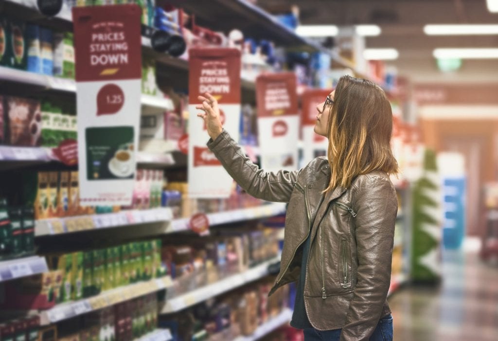 A person shops at a grocery store.
