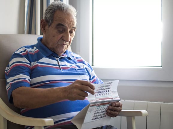 older person looking at a calendar.jpg