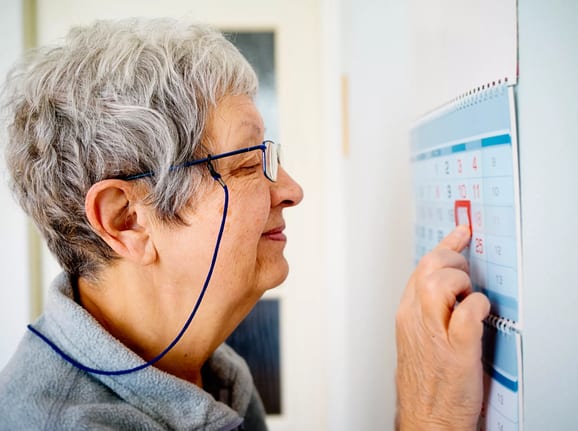 older woman looking at calendar.jpg