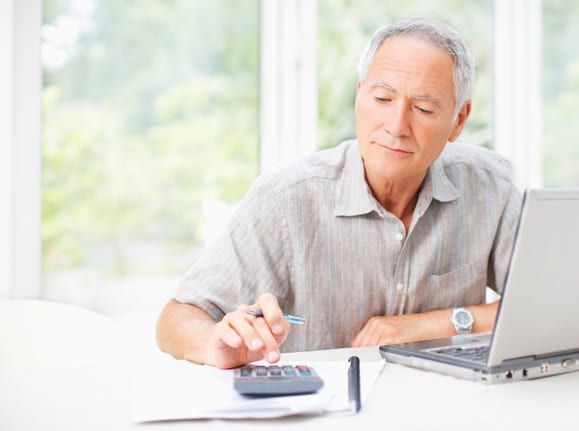 senior man using calculator gettyimages 107071080 KYLDaV