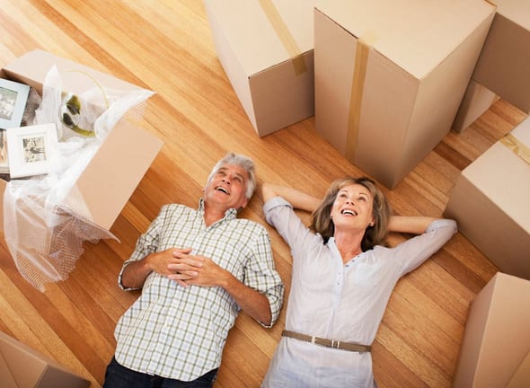 Happy mature couple laying on the floor surro.width rNWebku.jpg