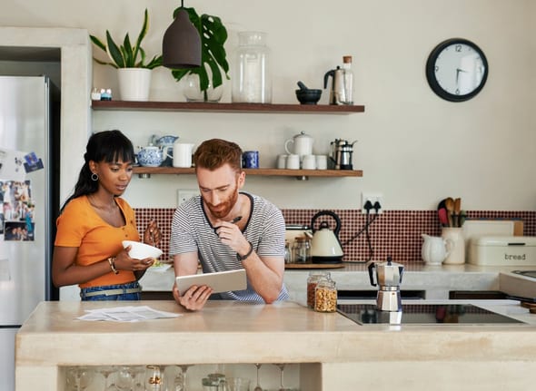 young couple in kitchen on tablet duUFRV.width .jpg