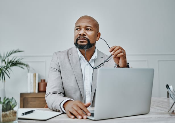 older man laptop in business suit gettyimages