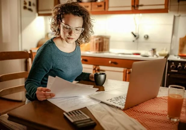 woman with bills and computer.width .jpg