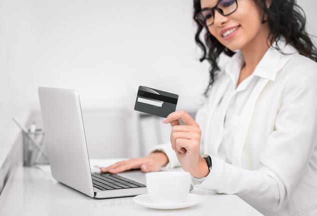 smiling woman with credit card.width .jpg