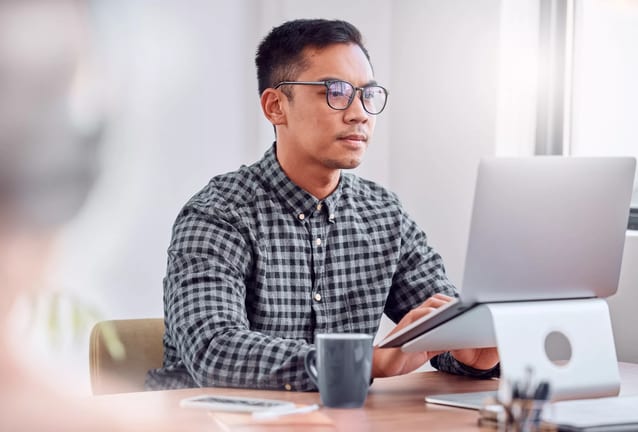 young man a person at a laptop gettyimages .jpg
