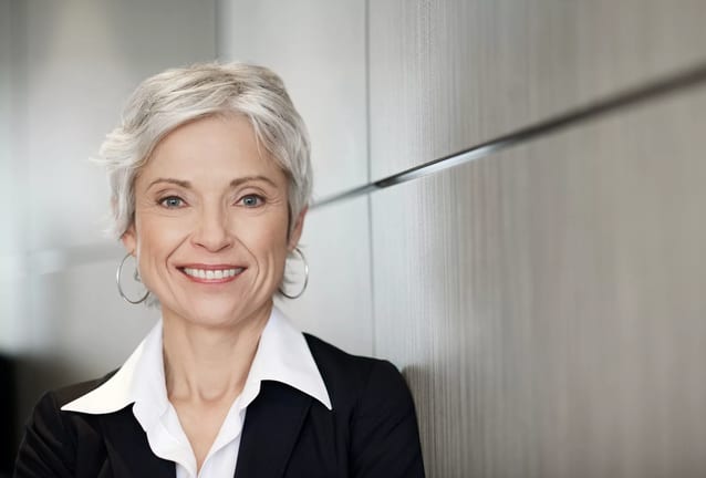 woman older gray hair suit gettyimages .jpg